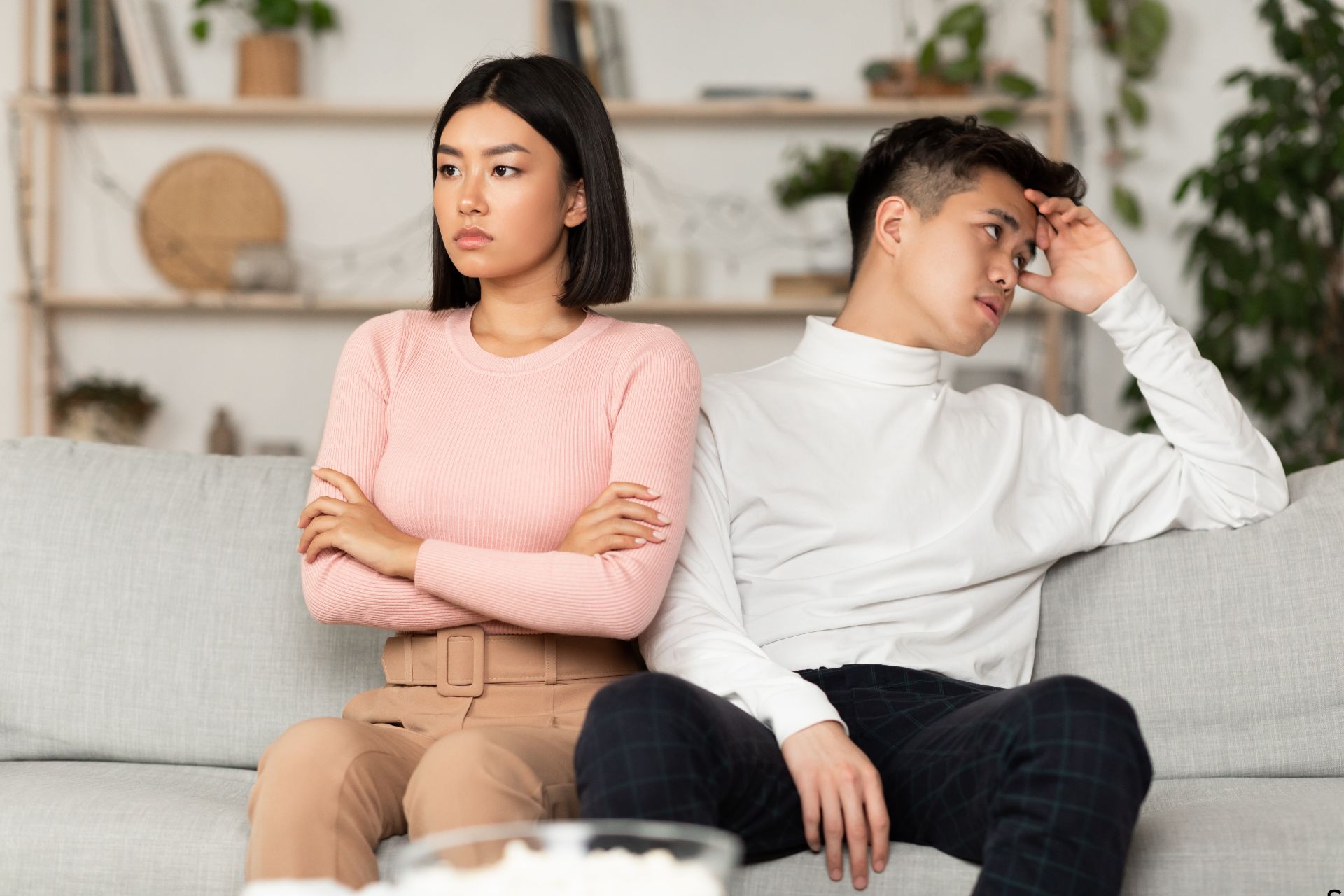 young couple in a toxic relationship ignoring each other over a disagreement