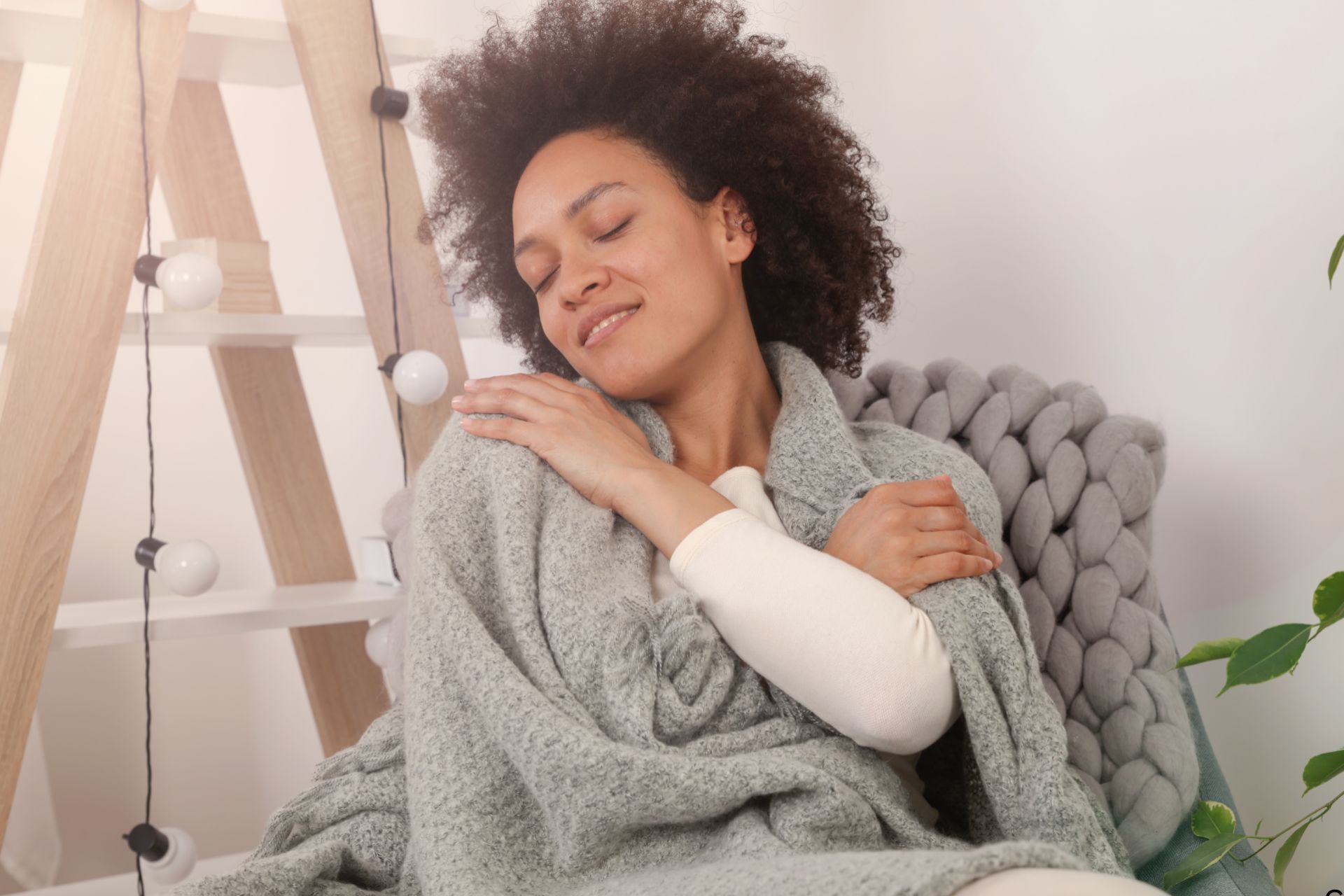 beautiful young woman with anxiety hugging herself